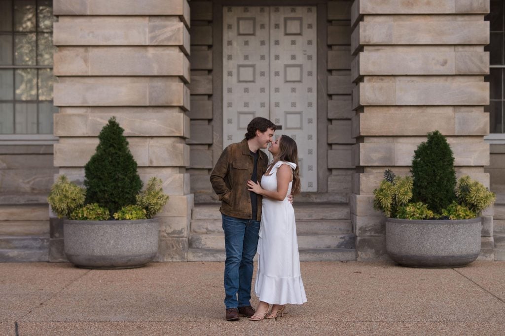 Couple kissing on the state capital in downtown Raleigh - Engagement Session