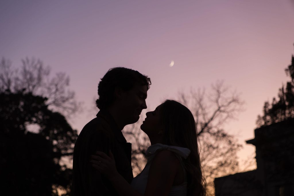 Couple about to kiss with the moon in the back - Downtown Raleigh Engagement Session Amelia and Matt Photo