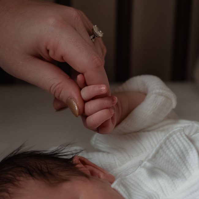 Newborn Baby holding Mom's finger - Raleigh NC Newborn Photography Session