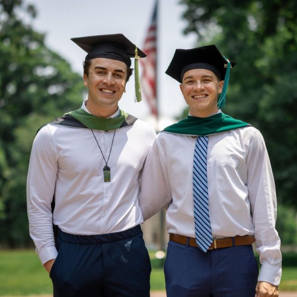 Two UNC student standing together posing for a portrait in their Graduation Photo Session with Amelia and Matt Photo in Chapel Hill North Carolina